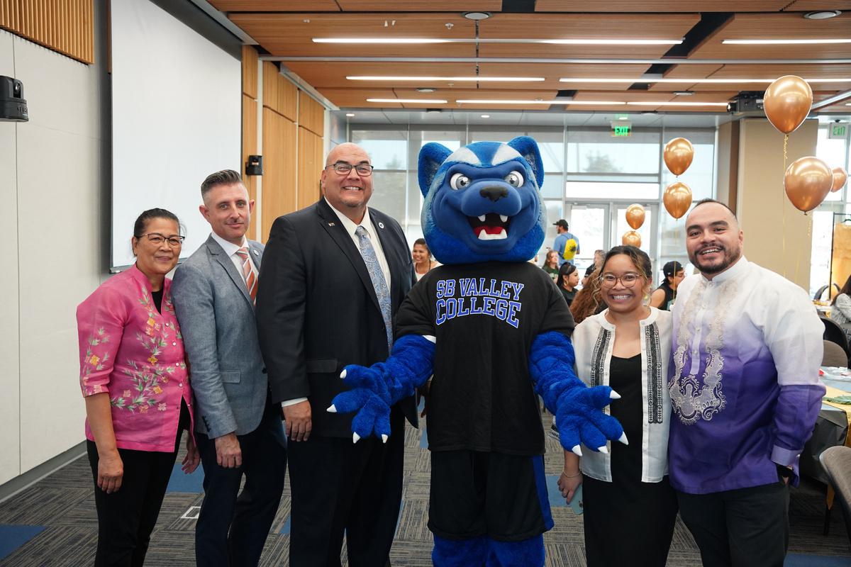 Blue the mascot with SBVC president, Dr. Zarate and members of the Filipino American History Month event