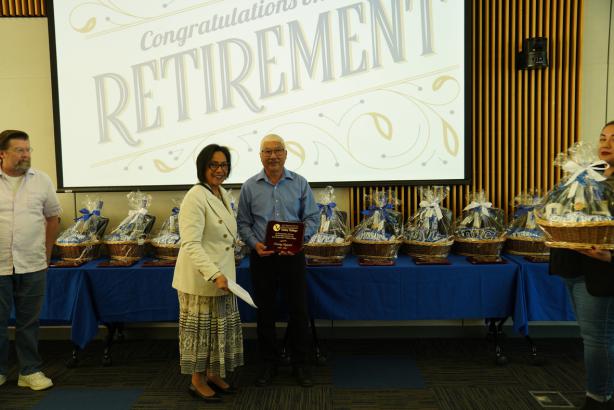 Interim President Dr. Linda Fontanilla standing with retiring colleagues 