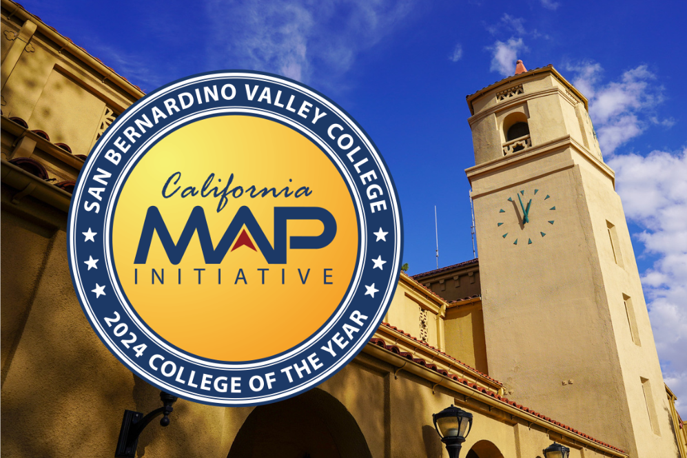 The California MAP Initiative seal with the words "San Bernardino Valley College 2024 College of the Year" in a circle around the seal. The inside of the seal is gold and the rim is blue and white. The seal overlays an image of the SBVC Auditorium's clocktower.