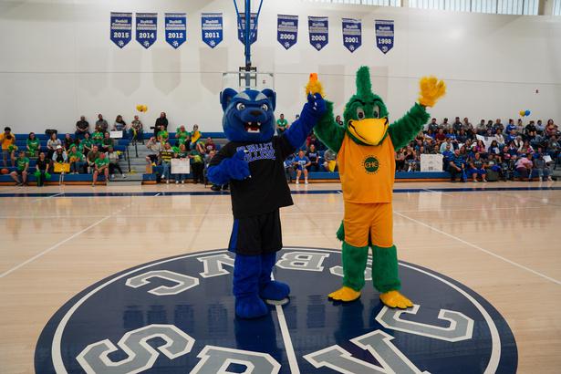 SBVC mascot Blue with CHC mascot Riker cheering the crowd on