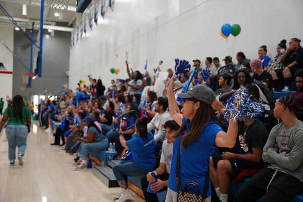 Fans cheering from the sidelines