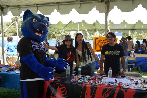 Blu the Wolverine with students from a club